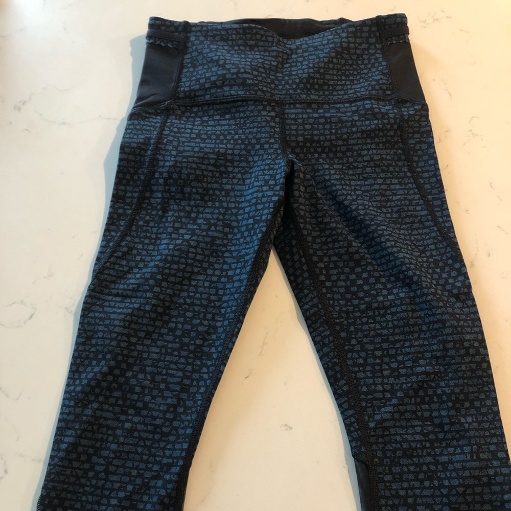 Lululemon crops (just below the knee length) with mesh accents!